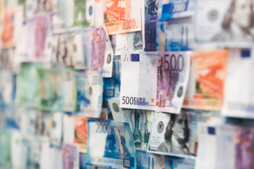 Close-up many different European currency money 500, 200, 100 euro banknotes bill. Symbolic photo for wealth and investment. Euro, dollars and russian rubles bill. Current focus.