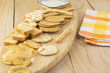 Assorted crackers, potato chips, mini party toasts.