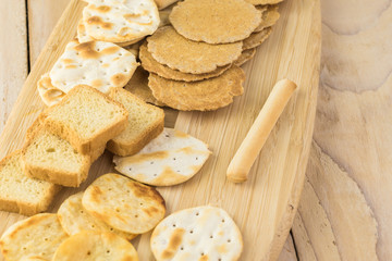Assorted crackers, potato chips, mini party toasts.