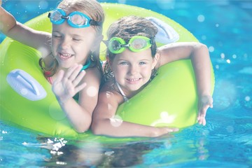 Kid in swimming pool.