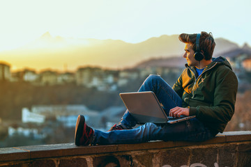  Handsome young man working on laptop