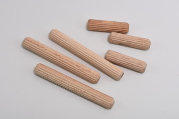 Close up heap of wooden dowel pins