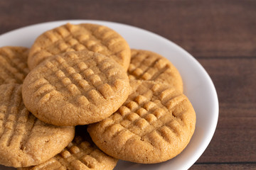 Classic Homemade Peanut Butter Cookies on a White Saucer