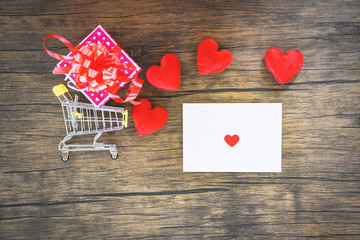 Valentines day shopping and red heart  gift box on shopping cart and Envelope love mail Valentine Letter