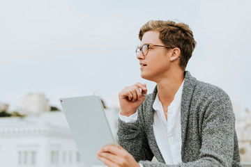 Man using a digital tablet at a rooftop in San Francisco