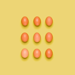 Eggs pattern on yellow background. Easter concept. Flat lay, top view. Food background.