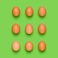Eggs pattern on green background. Easter concept. Flat lay, top view. Food background.