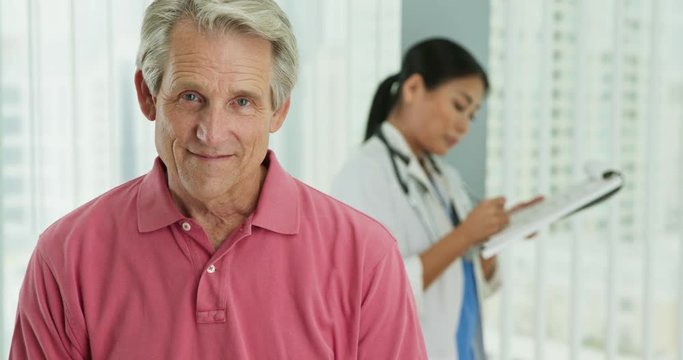 Close up of senior Caucasian male patient looking at camera and smiling