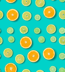 Citrus Fruit pattern on blue background. Orange, Lime, Lemon slices background. Flat lay, top view. Seamless pattern.