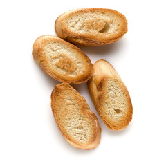 Toasted baguette slices isolated on white background close up.  Toast, crouton.   Top view.