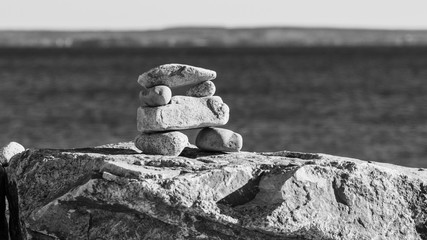 little stone inukshuk pile closeup, beach, sand, rocks, stones, art