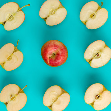 Fruit pattern of apple halves on blue background. Flat lay, top view. Food background.