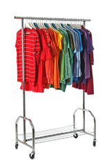 Wardrobe rack with different colorful clothes on white background