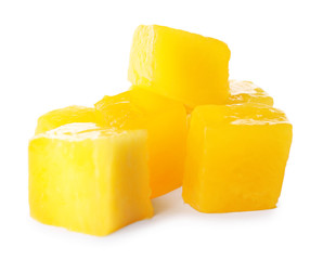 Fresh juicy mango cubes on white background