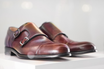 Pair Of Brown Elegant Men's Leather Shoes On Gray Background. Men's Luxury Classic Shoes, Minimalism, Selective Focus.