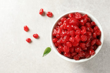 Bowl of sweet cherries on table, top view with space for text. Dried fruit as healthy snack