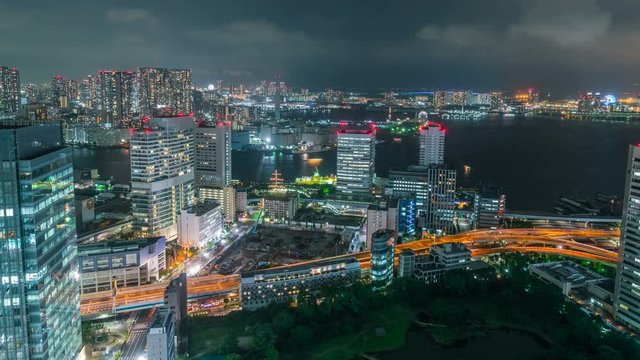 Timelapse of Tokyo Bay Waterfront Cityscape at Night -Zoom In-