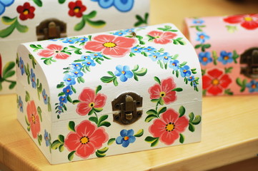 Fototapeta na wymiar colored wooden box with popular motif from Romania