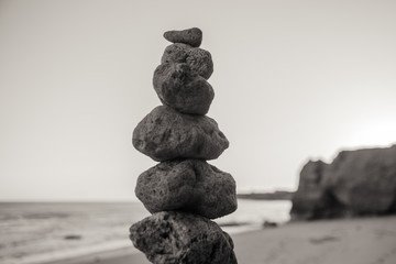 Stones balance on beach, sunset shot