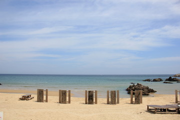 beach with chairs and umbrellas