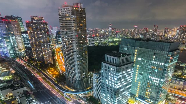 Timelapse Overview of City Transit below Tokyo Skyline at Night -Long Shot-