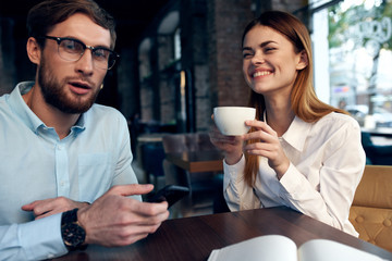 colleagues with coffee in a cafe