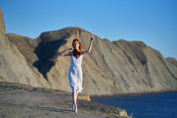 woman walking along the shore