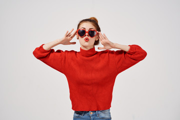 cute woman wearing glasses in a red sweater emotions