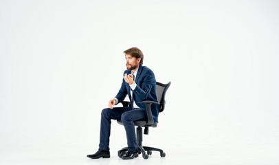 business man sitting in a chair on an isolated background