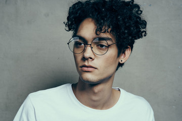african man with curls in glasses