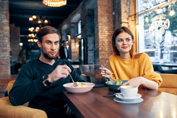 friends have lunch in a cafe