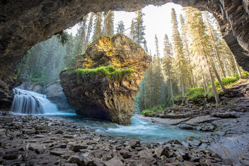 Johnston Canyon cave in Spring season with waterfalls, Johnston Canyon Trail, Alberta, Canada - 243968912