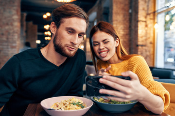 young couple selfie in cafe