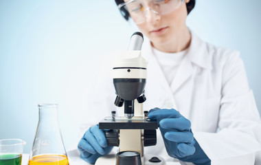 scientist looking at microscope