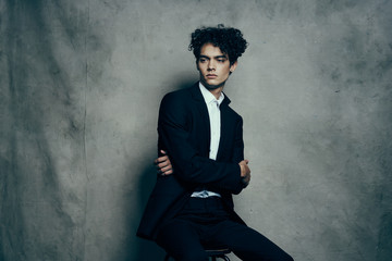 curly man in a jacket