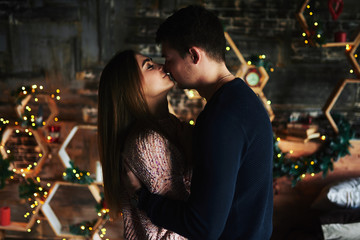 Lovers in the Christmas house.