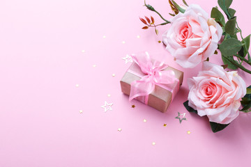 Gift box and pink roses