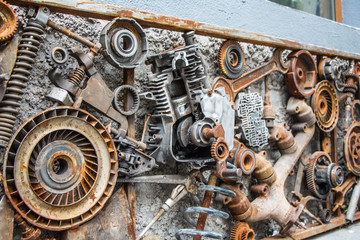metal vintage machinery and engine parts gathered in patterns as steampunk background