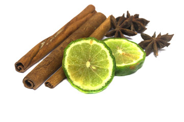 Bergamot or Kaffir lime Cut half with cinnamon and star aniseed isolate on white background
