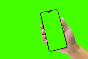 Man holding a black mobile phone and green screen isolated on a green background. - Powered by Adobe