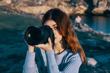 woman takes pictures of nature