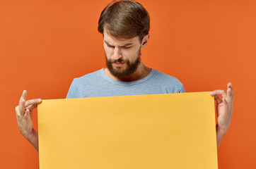 man looking at yellow blank background place free