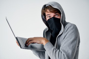 hacker man hacking into a computer network in a laptop