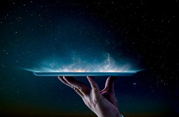 Waiter hand holding an empty digital tablet smoke effect . - obrazy, fototapety, plakaty