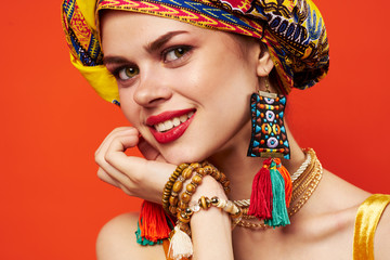 woman in a headdress smile portrait bright makeup fashion