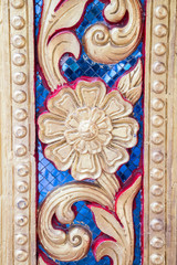 Blue and gold floral mosaic detail trim on door at Doi Suthep temple in Chiang Mai Thailand