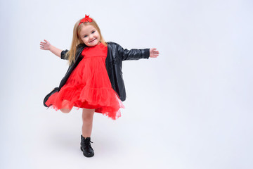 Concept portrait of a cute little girl in fashionable clothes. beautiful child