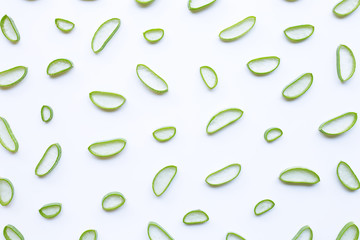 Aloe vera slices on white background.