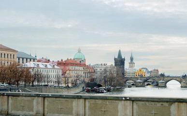 Prague, Czech Republic, view of the embankment at the Charles bridge. In the center of the picture you can see the old town bridge tower, on the right - Charles bridge... 