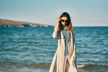 Fototapeta na wymiar woman against the sea shore summer vacation